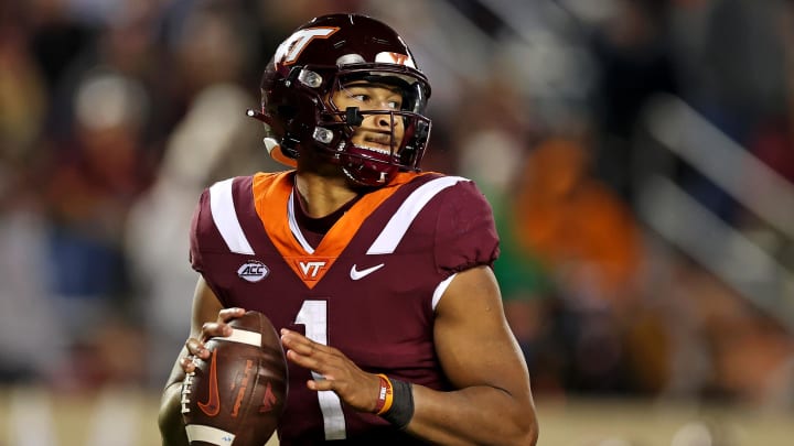 Nov 18, 2023; Blacksburg, Virginia, USA; Virginia Tech Hokies quarterback Kyron Drones (1) throws a pass against the North Carolina State Wolfpack at Lane Stadium. Mandatory Credit: Peter Casey-USA TODAY Sports