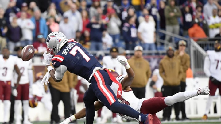 Nov 5, 2023; Foxborough, Massachusetts, USA;  New England Patriots wide receiver JuJu Smith-Schuster (7) has the ball got through his hands during the second half against the Washington Commanders at Gillette Stadium. Mandatory Credit: Bob DeChiara-USA TODAY Sports