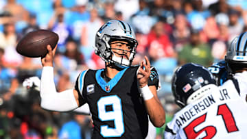 Oct 29, 2023; Charlotte, North Carolina, USA; Carolina Panthers quarterback Bryce Young (9) passes the ball as Houston Texans defensive end Will Anderson Jr. (51) pressures in the fourth quarter at Bank of America Stadium. 