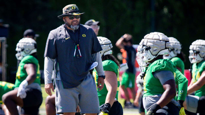 Oregon defensive line coach Tony Tuioti walks the field during practice with the Ducks Wednesday, Aug. 9, 2023 in Eugene.