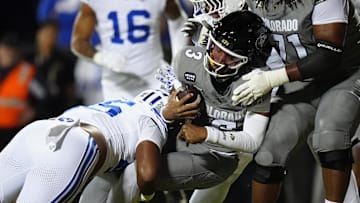 Sep 27, 2025; Boulder, Colorado, USA; Colorado Buffaloes quarterback Kaidon Salter (3) scores a touchdown past Brigham Young Cougars defensive end Viliami Po'uha (45) in the first quarter at Folsom Field. Mandatory Credit: Ron Chenoy-Imagn Images