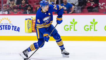 Jan 9, 2025; Ottawa, Ontario, CAN; Buffalo Sabres center Dylan Cozens (24) shoots the puck in the second period against the Ottawa Senators at the Canadian Tire Centre. Mandatory Credit: Marc DesRosiers-Imagn Images