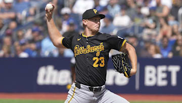 Jun 1, 2024; Toronto, Ontario, CAN;  Pittsburgh Pirates starting pitcher Mitch Keller (23) throws against the Toronto Blue Jays during the second inning at Rogers Centre.
