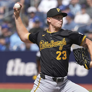 Jun 1, 2024; Toronto, Ontario, CAN;  Pittsburgh Pirates starting pitcher Mitch Keller (23) throws against the Toronto Blue Jays during the second inning at Rogers Centre.