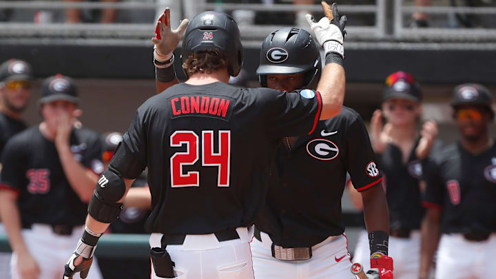 Georgia's Charlie Condon (24) celebrates with a teammate after hitting a home run during a NCAA Athens Regional baseball game against Army in Athens, Ga., on Friday, May 31, 2024.