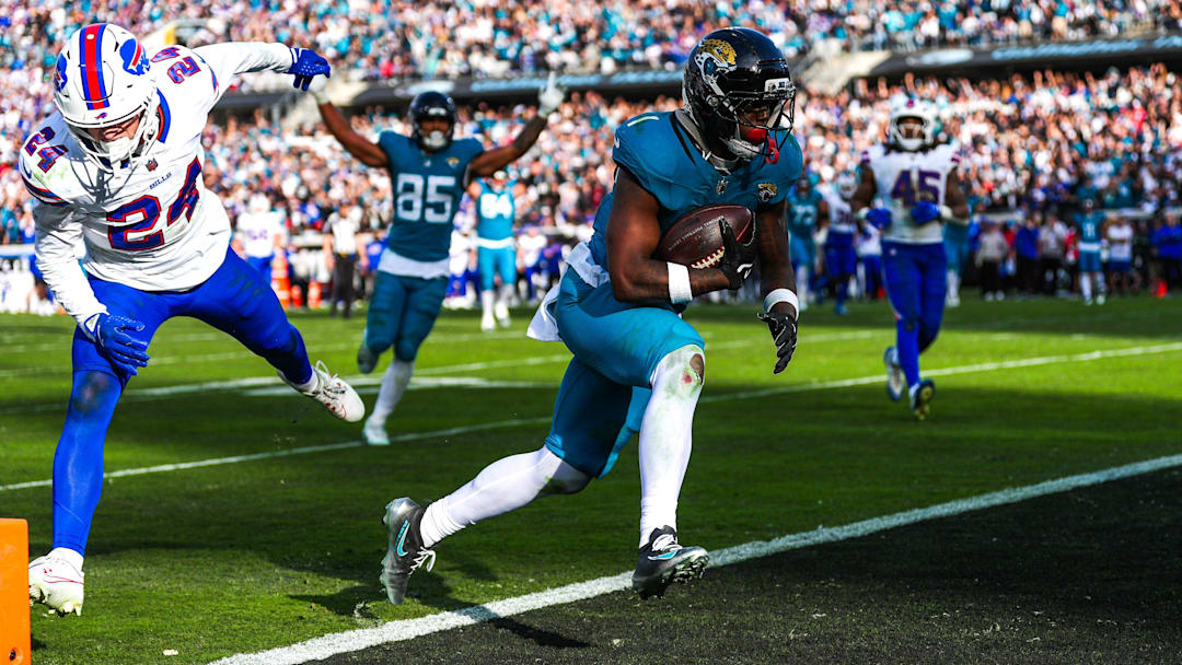 Jacksonville Jaguars running back Travis Etienne Jr. (1) scores a touchdown during the fourth quarter in an NFL football AFC Wild Card playoff matchup, Sunday, Jan. 11, 2026, in Jacksonville, Fla. Bills lead 10-7 at the half over the Jaguars. The Bills defeated the Jaguars 27-24. [Doug Engle/Florida Times-Union]