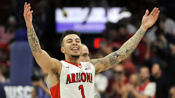 Mar 3, 2016; Tucson, AZ, USA; Arizona Wildcats guard Gabe York (1) signals to the crowd after beating the California Golden Bears at McKale Center. Arizona won 64-61. Mandatory Credit: Casey Sapio-Imagn Images