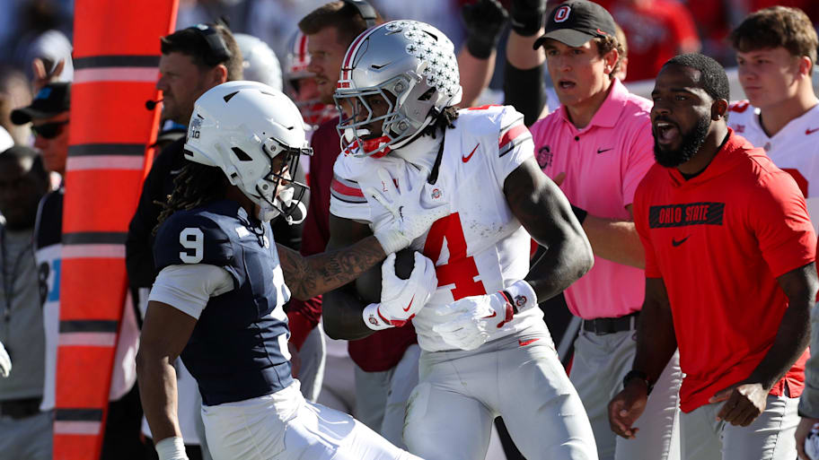 Ohio State wide receiver Jeremiah Smith is bumped out of bounds vs. Penn State.