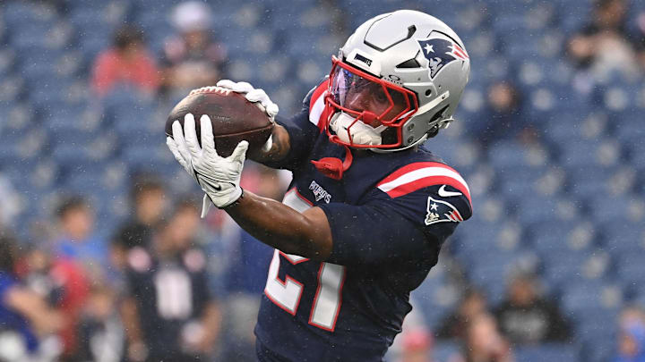 August 8, 2024; Foxborough, MA, USA;  New England Patriots running back Antonio Gibson (21) warms up before a game against the Carolina Panthers at Gillette Stadium.