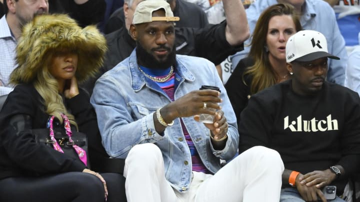 May 13, 2024; Cleveland, Ohio, USA; Savannah James, LeBron James and Rich Paul sit in the front in the fourth quarter of game four of the second round for the 2024 NBA playoffs between the Cleveland Cavaliers and the Boston Celtics at Rocket Mortgage FieldHouse. Mandatory Credit: David Richard-USA TODAY Sports