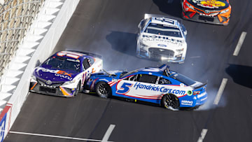 Mar 20, 2022; Hampton, Georgia, USA; NASCAR Cup Series driver Kyle Larson (5) crashes into Denny Hamlin (11) during the Folds of Honor QuikTrip 500 at Atlanta Motor Speedway.