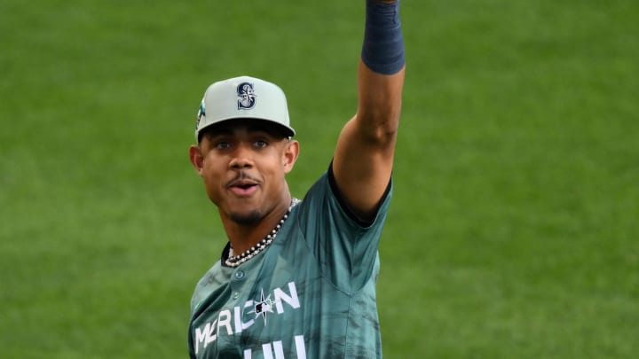 Jul 11, 2023; Seattle, Washington, USA; American League center fielder  Julio RodrIguez  of the Seattle Mariners (44) plays catch with fans during the eighth inning at T-Mobile Park. Mandatory Credit: Steven Bisig-USA TODAY Sports