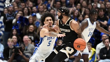 Nov 16, 2024; Durham, North Carolina, USA; Duke basketball guard Tyrese Proctor (5) guards Wofford Terriers guard Corey Tripp (10) in the second half at Cameron Indoor Stadium.