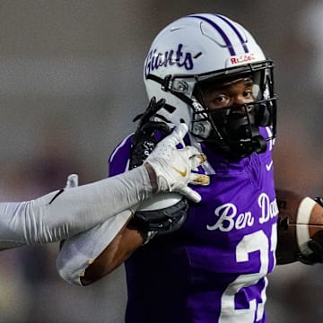 Ben Davis running back Alijah Price (21) brushes off Cathedral defender during their matchup in 2024.