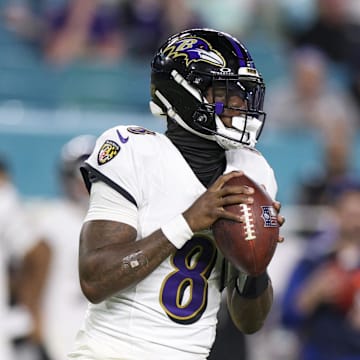 Oct 30, 2025; Miami Gardens, Florida, USA; Baltimore Ravens quarterback Lamar Jackson (8) looks to pass against the Miami Dolphins in the third quarter at Hard Rock Stadium. Mandatory Credit: Nathan Ray Seebeck-Imagn Images