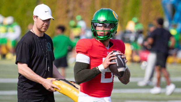 Oregon quarterback Dillon Gabriel throws out a pass during practice with the Oregon Ducks 