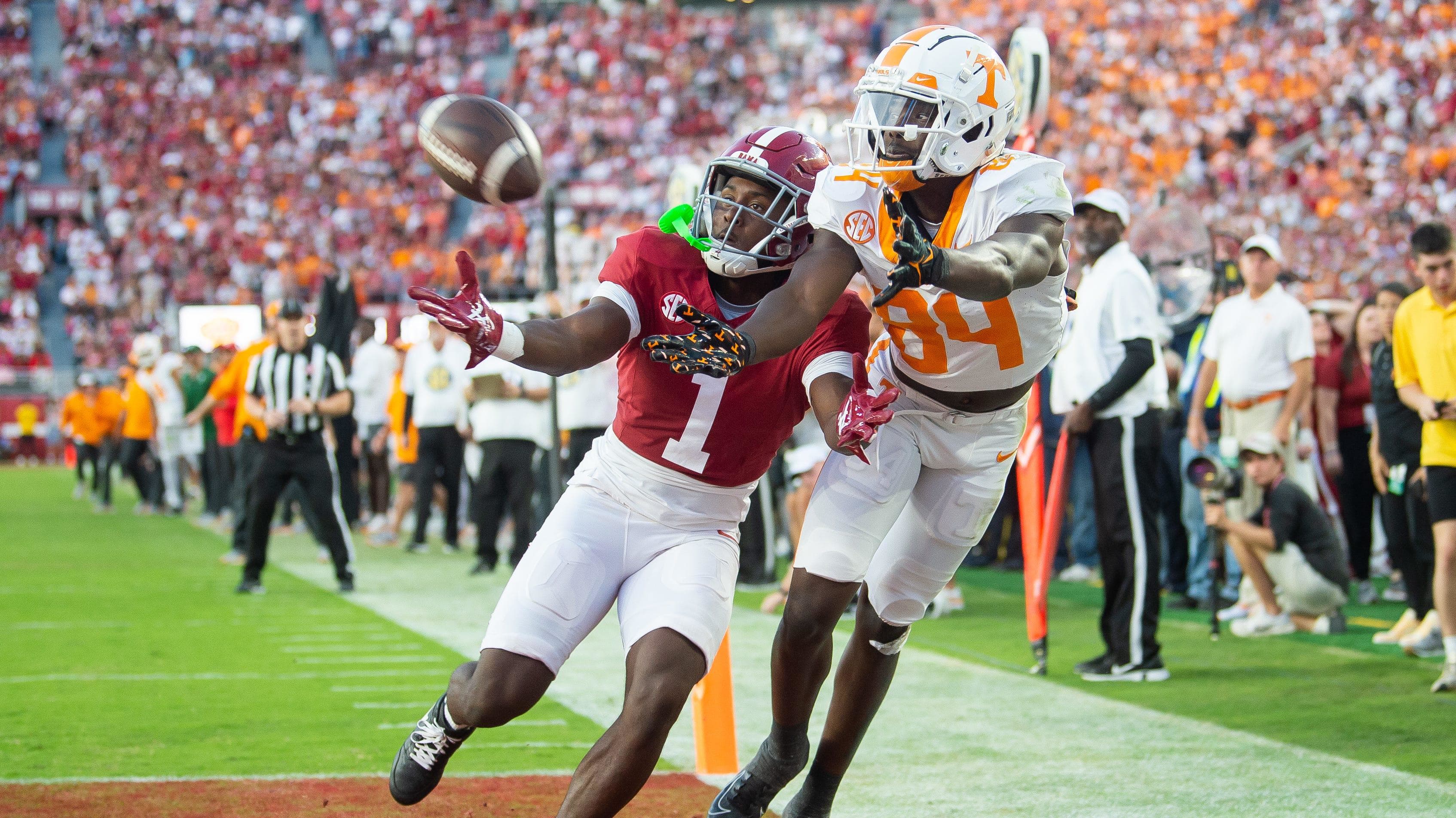 Tennessee wide receiver Kaleb Webb (84) reaches for the ball while defended by Alabama defensive back Kool-Aid McKinstry.