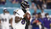 Oct 30, 2025; Miami Gardens, Florida, USA; Baltimore Ravens quarterback Lamar Jackson (8) looks to pass against the Miami Dolphins in the third quarter at Hard Rock Stadium. Mandatory Credit: Nathan Ray Seebeck-Imagn Images