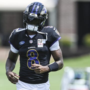 Baltimore Ravens quarterback Lamar Jackson  (8) runs across the field during the afternoon session of training camp at the Under Armour Performance Center,  