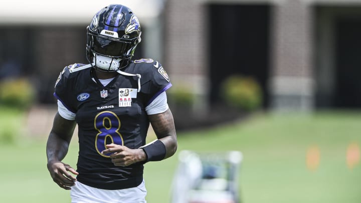 Baltimore Ravens quarterback Lamar Jackson  (8) runs across the field during the afternoon session of training camp at the Under Armour Performance Center,  