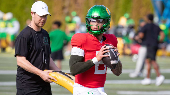 Oregon quarterback Dillon Gabriel throws out a pass during practice with the Oregon Ducks Wednesday Aug. 21, 2024 at the Hatfield-Dowlin Complex in Eugene, Ore.