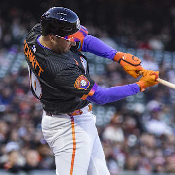 Apr 8, 2025; San Francisco, California, USA;  San Francisco Giants first baseman Casey Schmitt (10) hits a double against the Cincinnati Reds during the second inning at Oracle Park. 