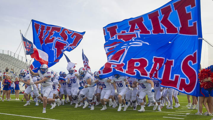 Austin Westlake players enter the field against Lake Travis at the UIL Class 6A D1 quarterfinal on Dec. 2, 2023.