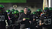 Nov 22, 2025; Eugene, Oregon, USA; Oregon Ducks head coach Dan Lanning leads the team to the field before the game against the Southern California Trojans at Autzen Stadium. Mandatory Credit: Troy Wayrynen-Imagn Images