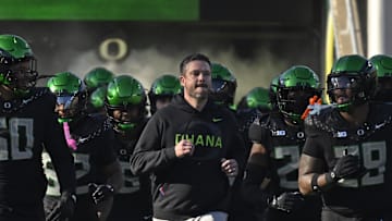 Nov 22, 2025; Eugene, Oregon, USA; Oregon Ducks head coach Dan Lanning leads the team to the field before the game against the Southern California Trojans at Autzen Stadium. Mandatory Credit: Troy Wayrynen-Imagn Images