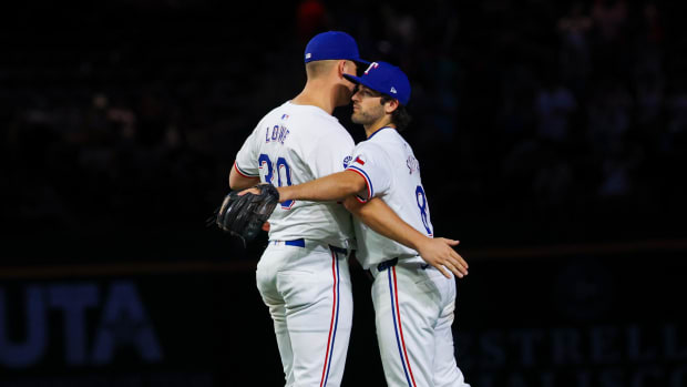 Nathaniel Lowe and Josh Smith celebrate Wednesday's win over the White Sox.