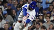 Oct 9, 2025; Chicago, Illinois, USA; Chicago Cubs right fielder Kyle Tucker (30) hits a home run against the Milwaukee Brewers during the seventh inning for game four of the NLDS round for the 2025 MLB playoffs at Wrigley Field. Mandatory Credit: David Banks-Imagn Images