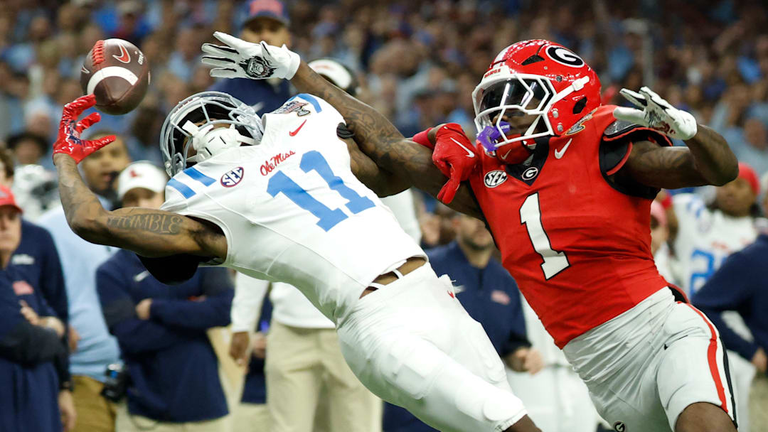 Jan 1, 2026; New Orleans, LA, USA; Mississippi Rebels wide receiver Deuce Alexander (11) attempts to make a catch defended by Georgia Bulldogs defensive back Ellis Robinson IV (1) in the first quarter during the 2026 Sugar Bowl and quarterfinal game of the College Football Playoff at Caesars Superdome. Mandatory Credit: Amber Searls-Imagn Images