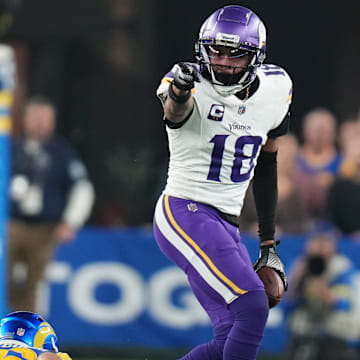 Minnesota Vikings receiver Justin Jefferson signals a first down after a catch against the Los Angeles Rams during their playoff game at State Farm Stadium on Jan. 13, 2025, in Glendale, Ariz.