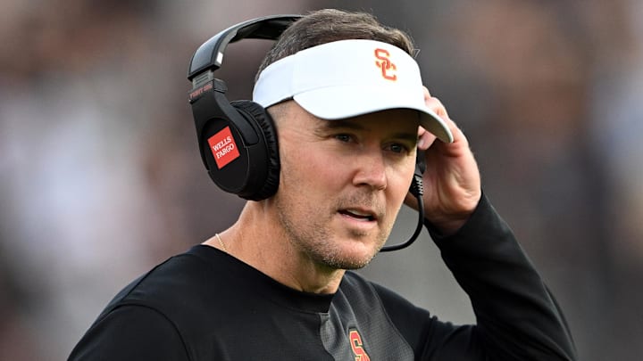 Sep 13, 2025; West Lafayette, Indiana, USA; Southern California Trojans head coach Lincoln Riley stands on the sidelines during the first quarter against the Purdue Boilermakers at Ross-Ade Stadium. Mandatory Credit: Marc Lebryk-Imagn Images Sep 13, 2025; West Lafayette, Indiana, USA; Southern California Trojans head coach Lincoln Riley stands on the sidelines during the first quarter against the Purdue Boilermakers at Ross-Ade Stadium. Mandatory Credit: Marc Lebryk-Imagn Images