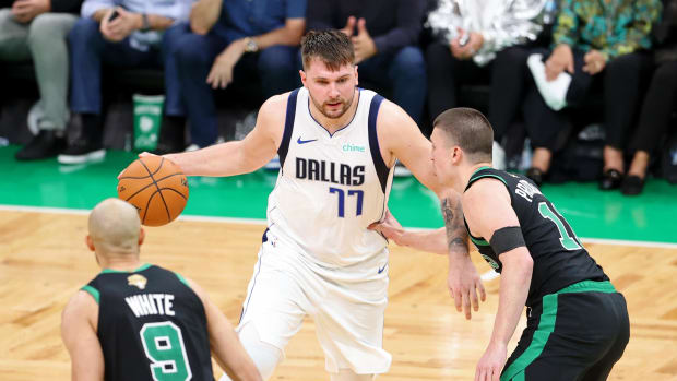 Jun 9, 2024; Boston, Massachusetts, USA; Dallas Mavericks guard Luka Doncic (77) dribbles the ball against Boston Celtics guard Payton Pritchard (11) during the fourth quarter in game two of the 2024 NBA Finals at TD Garden. Mandatory Credit: Peter Casey-USA TODAY Sports