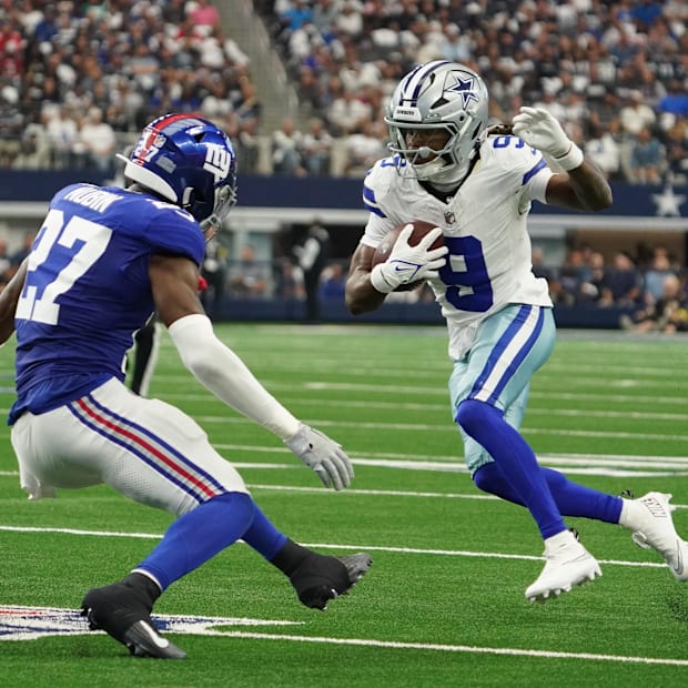Dallas Cowboys wide receiver KaVontae Turpin runs with the ball as New York Giants safety Tyler Nubin defends.