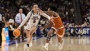 Mar 9, 2025; Greenville, SC, USA; South Carolina Gamecocks guard Tessa Johnson (5) brings the ball up court against Texas Longhorns guard Rori Harmon (3) during the second half at Bon Secours Wellness Arena. Mandatory Credit: Jim Dedmon-Imagn Images