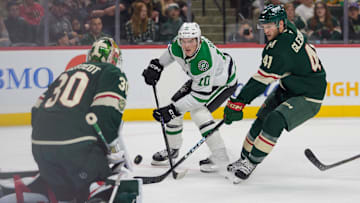 Sep 25, 2025; Saint Paul, Minnesota, USA; Dallas Stars center Oskar Back (10) shoots on Minnesota Wild goaltender Jesper Wallstedt (30) with defenseman Ben Gleason (41) on defense in the first period at Grand Casino Arena. Mandatory Credit: Matt Blewett-Imagn Images