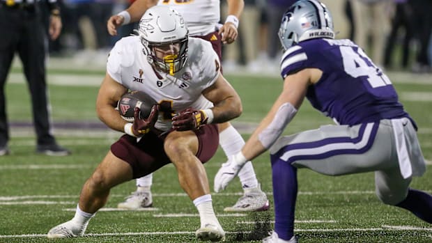 Arizona State Sun Devils running back Cam Skattebo (4) runs the ball against Kansas State Wildcats linebacker Austin Moore