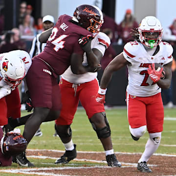 Nov 1, 2025; Blacksburg, Virginia, USA;  Louisville Cardinals running back Keyjuan Brown (22) runs the ball against the Virginia Tech Hokies during the fourth quarter at Lane Stadium. Mandatory Credit: Brian Bishop-Imagn Images