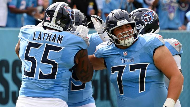 Oct 19, 2025; Nashville, Tennessee, USA; Tennessee Titans offensive tackle Peter Skoronski (77) and teammates celebrates after wide receiver Chimere Dike (17) scored a touchdown against the New England Patriots during the first half at Nissan Stadium. Mandatory Credit: Steve Roberts-Imagn Images