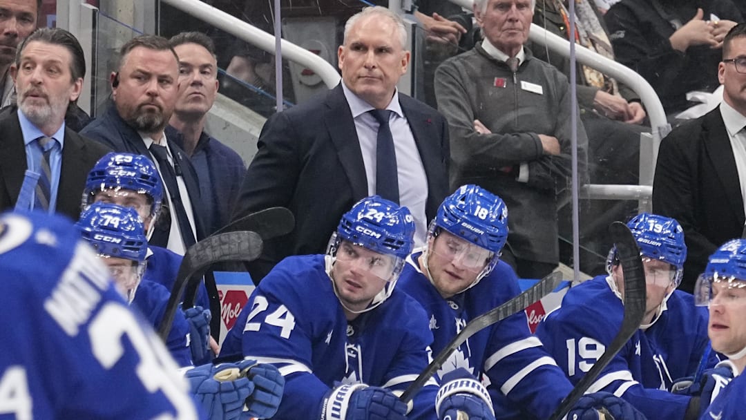 Apr 20, 2025; Toronto, Ontario, CAN; Toronto Maple Leafs head coach Craig Berube (center) watches the action during the third period of game one of the first round of the 2025 Stanley Cup Playoffs against the Ottawa Senators at Scotiabank Arena. Mandatory Credit: John E. Sokolowski-Imagn Images