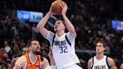Nov 29, 2025; Inglewood, California, USA;  Dallas Mavericks forward Cooper Flagg (32) goes to the basket past Los Angeles Clippers center Ivica Zubac (40) during the  third quarter at Intuit Dome. Mandatory Credit: Kiyoshi Mio-Imagn Images