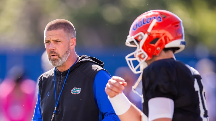 Florida Gators quarterback Graham Mertz (15) gets directions from Florida Gators head coach Billy Napier during University of Florida Gators’ Spring football practice at Sanders Practice Fields in Gainesville, FL on Thursday, March 28, 2024. [Doug Engle/Gainesville Sun]