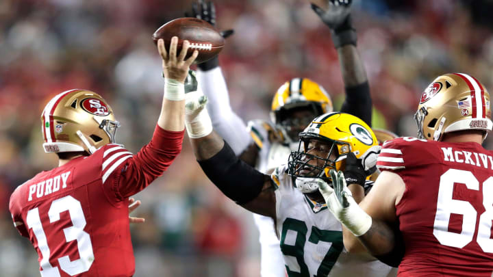 Green Bay Packers defensive tackle Kenny Clark (97) pressures San Francisco 49ers quarterback Brock Purdy.