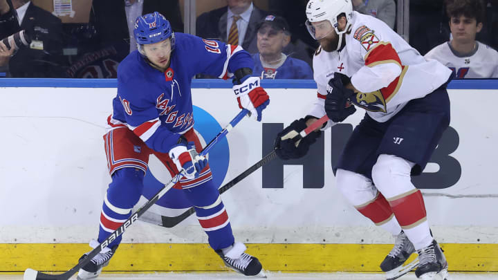 May 22, 2024; New York, New York, USA; New York Rangers left wing Artemi Panarin (10) controls the puck against Florida Panthers defenseman Aaron Ekblad (5) during the third period of game one of the Eastern Conference Final of the 2024 Stanley Cup Playoffs at Madison Square Garden. Mandatory Credit: Brad Penner-USA TODAY Sports