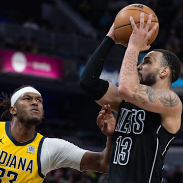 Mar 20, 2025; Indianapolis, Indiana, USA; Brooklyn Nets guard Tyrese Martin (13) shoots the ball while Indiana Pacers center Myles Turner (33) defends in the second half at Gainbridge Fieldhouse. Mandatory Credit: Trevor Ruszkowski-Imagn Images