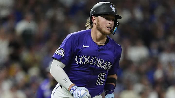 Colorado Rockies catcher Hunter Goodman (15) RBI singles in the sixth inning against the Los Angeles Dodgers at Coors Field.