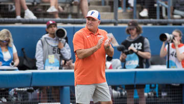 Jun 2, 2024; Oklahoma City, OK, USA; Florida Gators head coach Tim Walton claps in the fifth inning against the Alabama Crimson Tide during a Women's College World Series softball losers bracket elimination game at Devon Park. Mandatory Credit: Brett Rojo-USA TODAY Sports