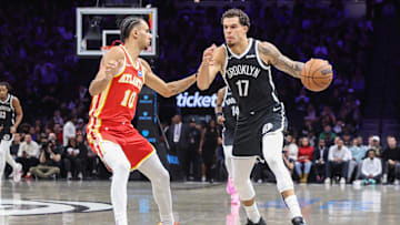 Oct 29, 2025; Brooklyn, New York, USA; Brooklyn Nets forward Michael Porter Jr. (17) looks to drive past Atlanta Hawks forward Zaccharie Risacher (10) in the second quarter at Barclays Center. Mandatory Credit: Wendell Cruz-Imagn Images
